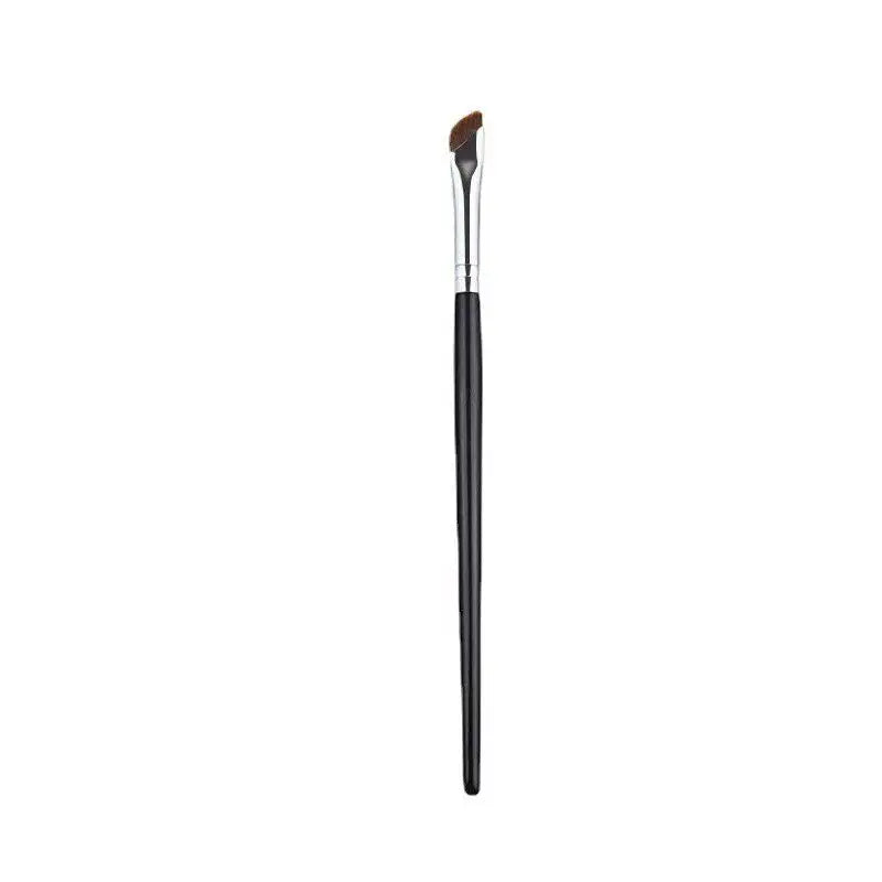 a close up of a black and white makeup brush