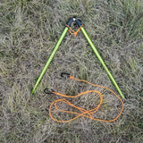 a pair of green and orange poles laying on the ground