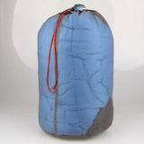 a blue sleeping bag with a red string