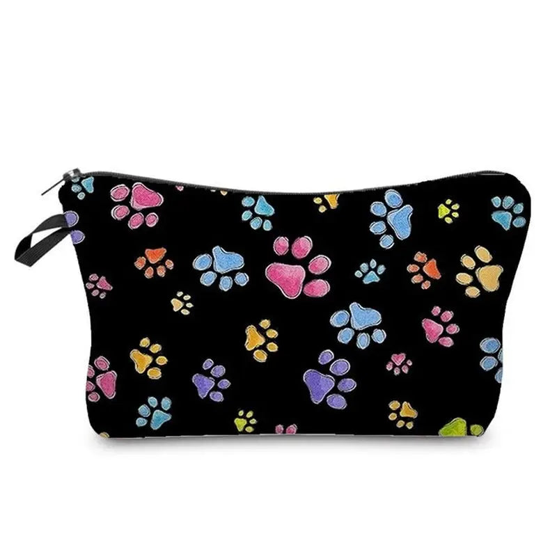 a black cosmetic bag with colorful paw prints