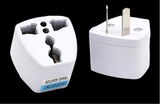 Universal power adapter with interchangeable plugs for international travel.