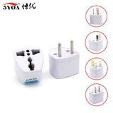 a white wall charger with four different plugs