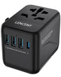 Universal travel adapter with multiple USB ports and AC outlet.