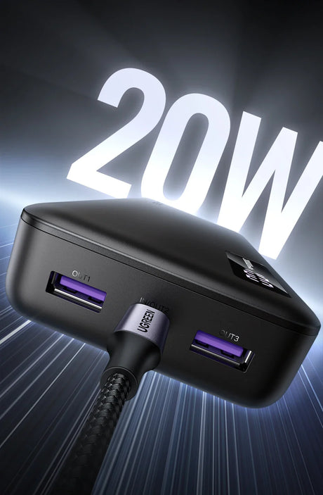 USB charging adapter with multiple ports and ’20W’ illuminated text above it.