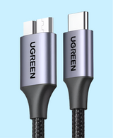 USB-C to USB-A cable with ’UGREEN’ branding on metallic connectors.