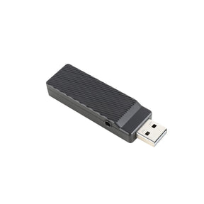 USB flash drive with a textured black plastic casing.