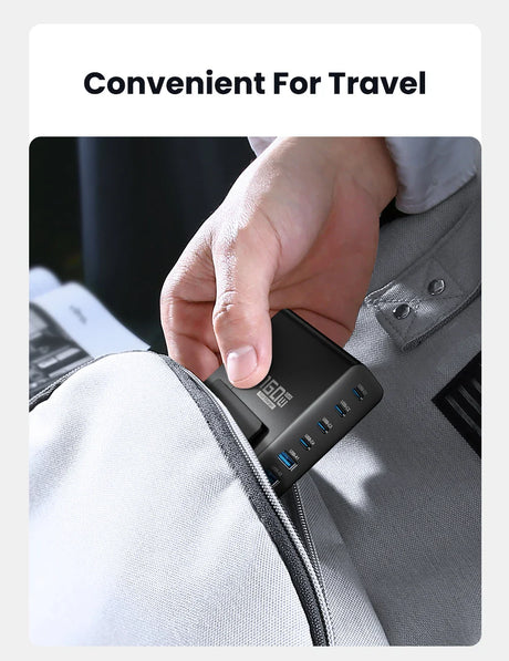 USB charging hub being inserted into a bag or pocket.