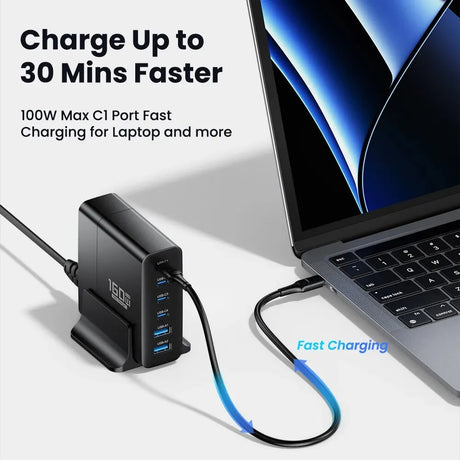 Fast-charging USB hub with multiple ports connected to a laptop.