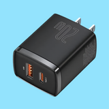 USB wall charger with two ports, one orange and one black.