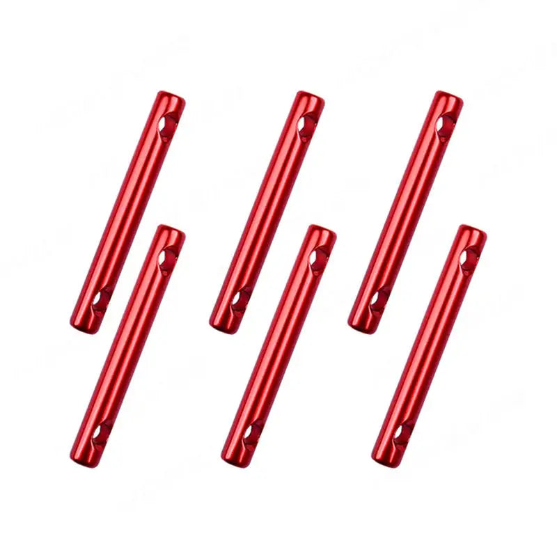 four red metal tubes are lined up on a white surface