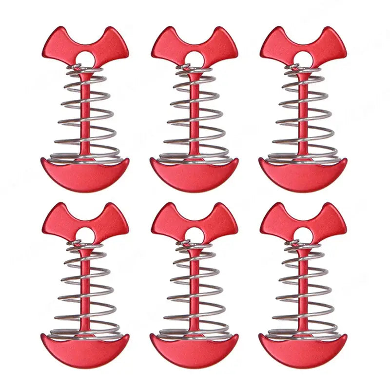 six red plastic hammers are sitting on a spring spring