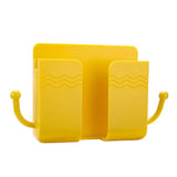 a yellow book holder with two books on it