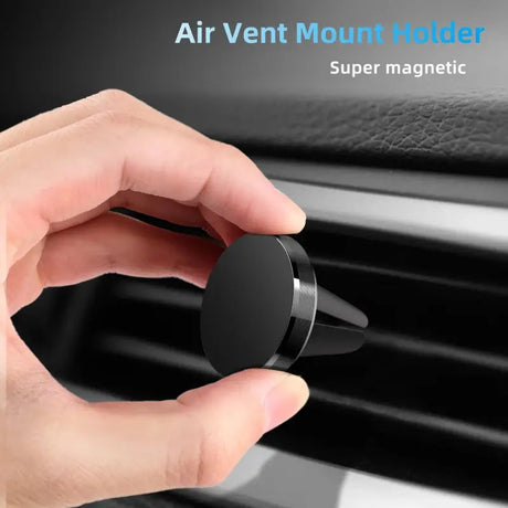 a close up of a person holding a black air vent mount holder