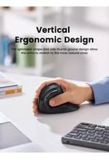 Vertical ergonomic computer mouse being used by a hand on a desk.