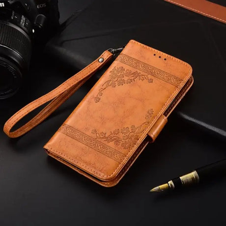 a close up of a camera and a cell phone on a table