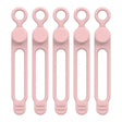 six pink plastic spoons with handles and handles on a white background