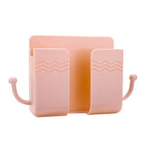 a pair of pink plastic bookends with a wave design