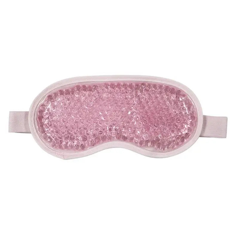 a close up of a pink eye mask with a pink sequin