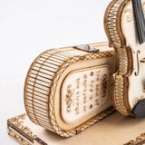 a violin shaped box with a violin on top