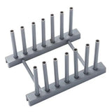 a set of four gray plastic pegs