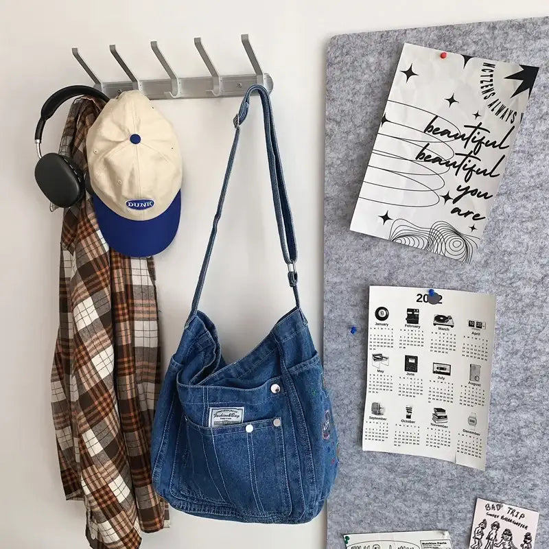 a wall mounted coat rack with a hat and scarf