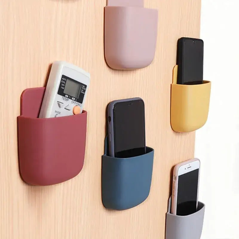 A wall mounted phone holder with multiple colors