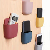 a wall mounted phone holder with multiple colors