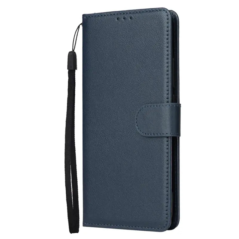 the back of a blue leather wallet case with a black strap