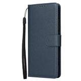 the back of a blue leather wallet case with a black strap