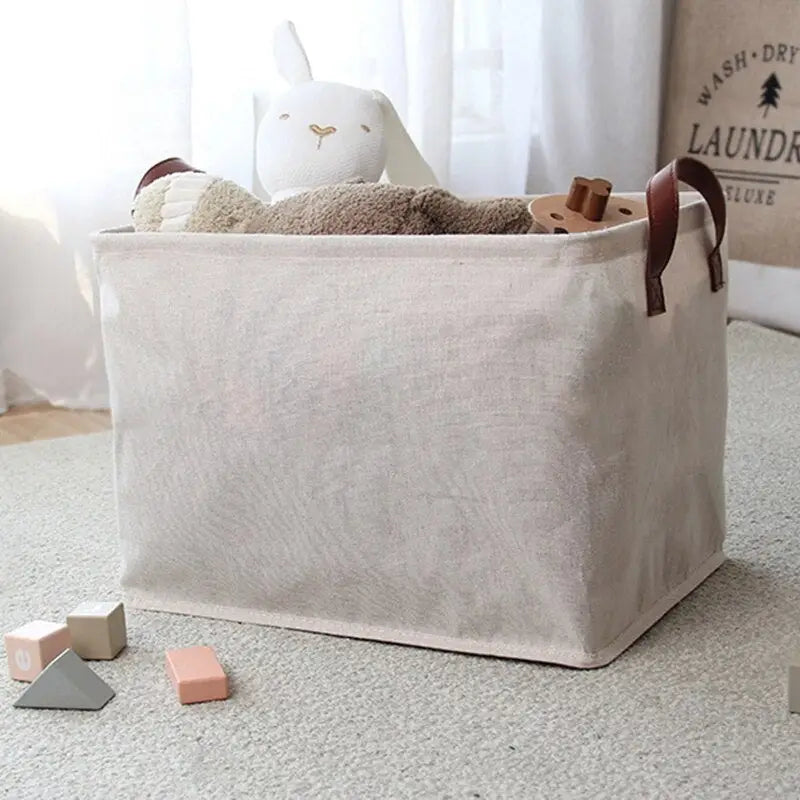 a small toy storage bag with a stuffed rabbit inside