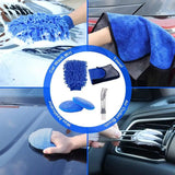 a close up of a person cleaning a car with a blue cloth