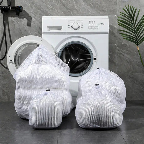 a washing machine with three bags of laundry products