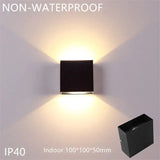 a black wall light with a white background