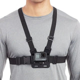a man wearing a camera strap