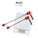 a scale with a red handle and a white background