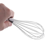 someone holding a whisk in their hand with a white background