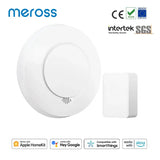 A white alarm with a button and a button on it
