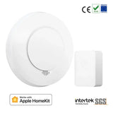 A white alarm with a button and a remote control