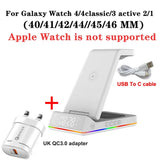 a white apple watch with a usb cable attached to it
