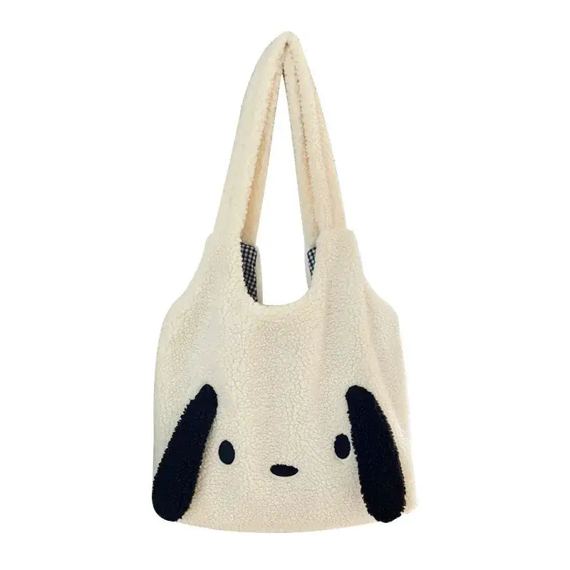 a white bag with black ears on it