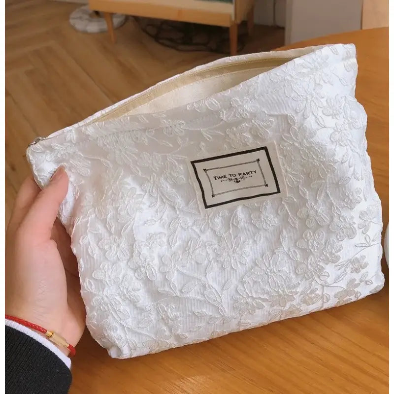 a white bag with a black label on it