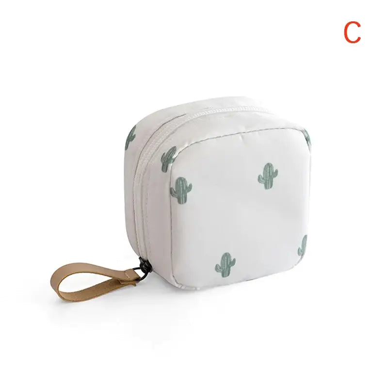 a white bag with cactus print