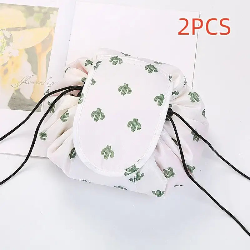 a white bag with green leaves on it