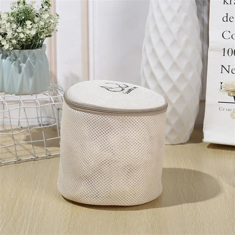 a white basket with a white lid on a table