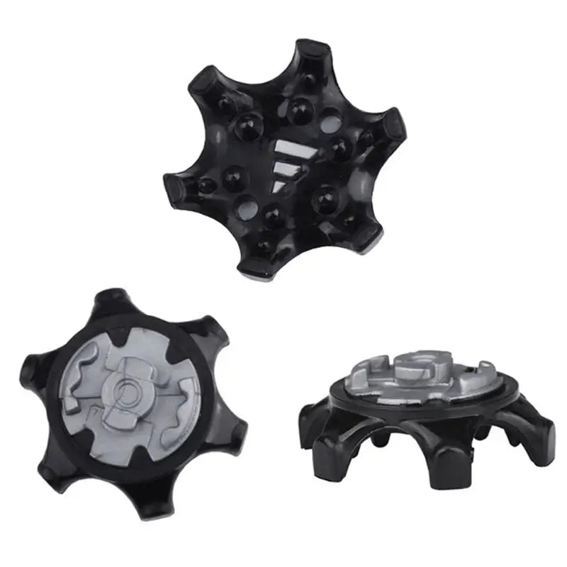 a set of four black and white plastic wheel hubs