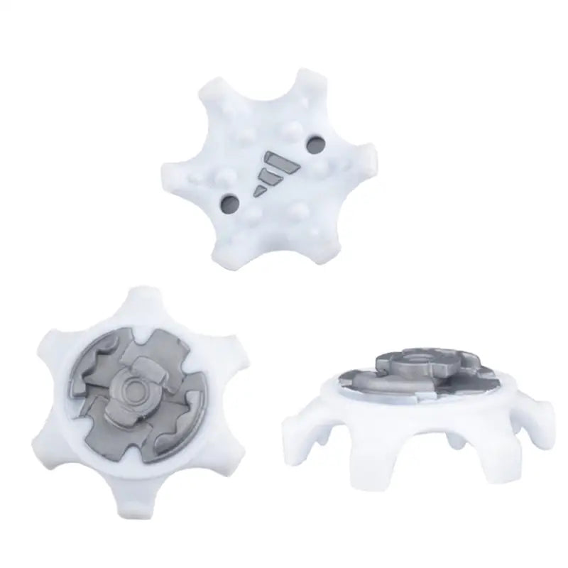 three white plastic gears with a black and white plastic gear