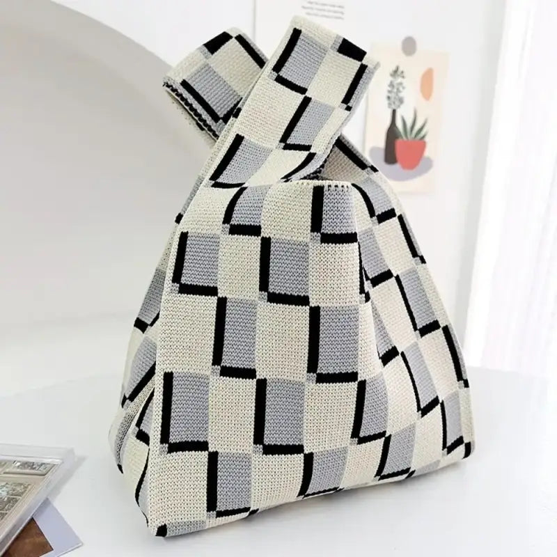 a white and black bag on a table
