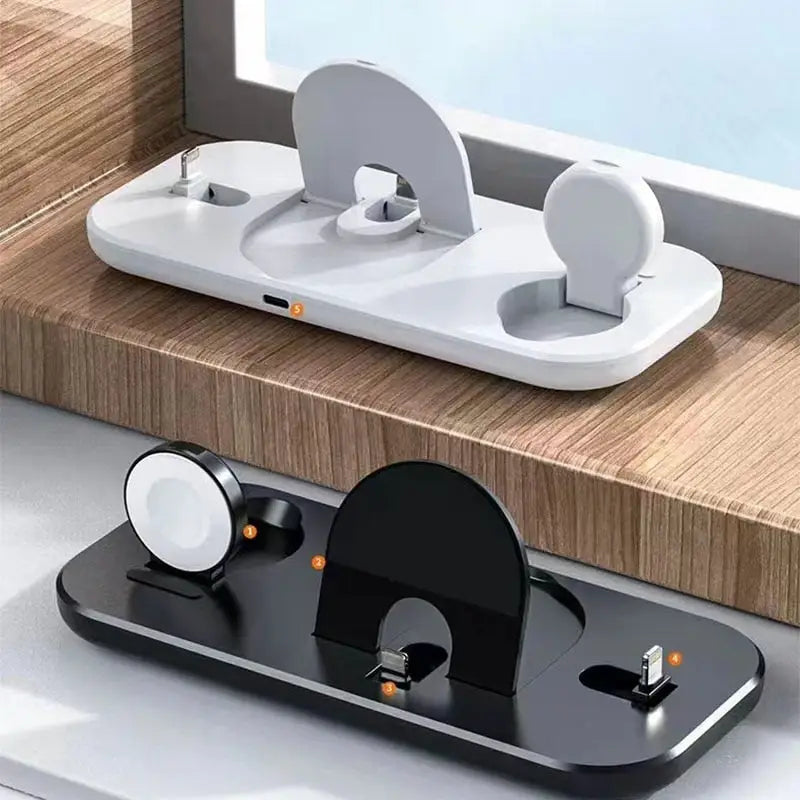 a white and black phone holder on a wooden table