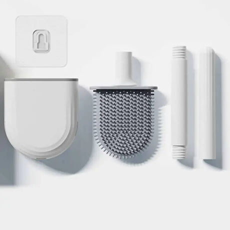 a white wall mounted device with a hair brush, comb and comb