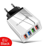 a white and black usb charger with four different ports